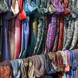a picture of many scarves on display
