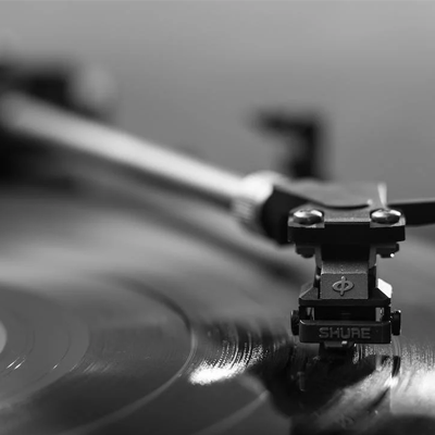 Black and white photo of a record needle on a record.