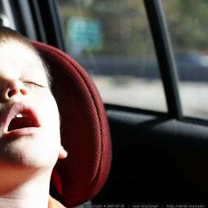 Child sleeping in booster seat