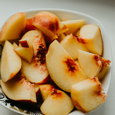 Bowl of sliced peaches
