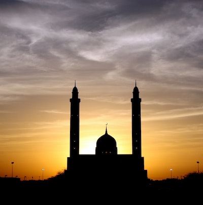 Mosque with sun setting in the background