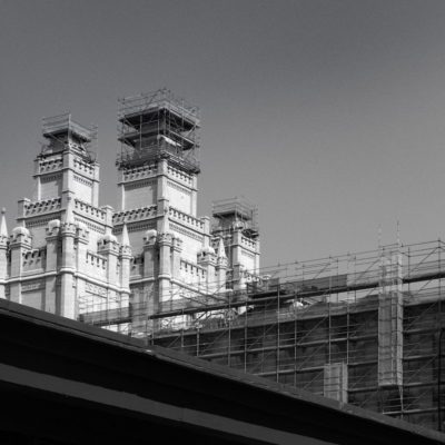 Black and white photo of church buildings with scaffolding