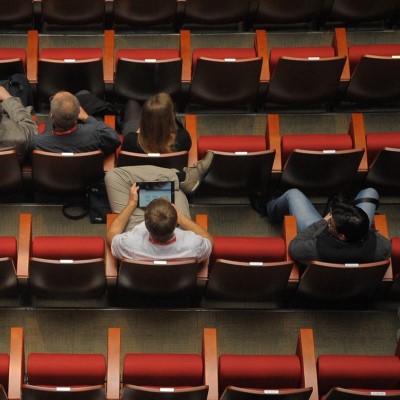 People in theater seats, seen from above