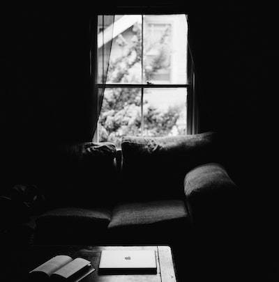 Couch against window in black and white