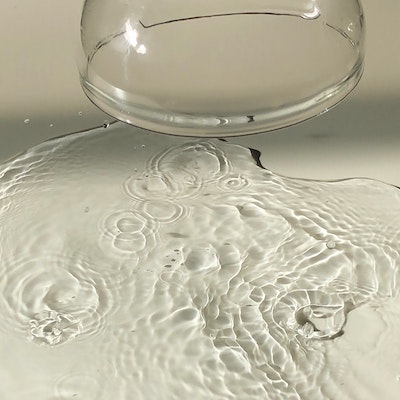 Spilled water out of a glass cup
