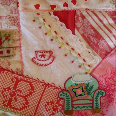 close-up of a pink and white baby quilt