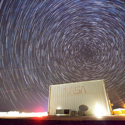 NASA building under a sky of stars