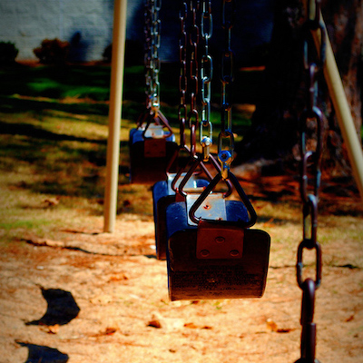 Swing set at the park in the dark