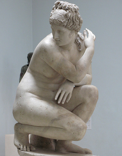 art sculpture of a woman crouched down