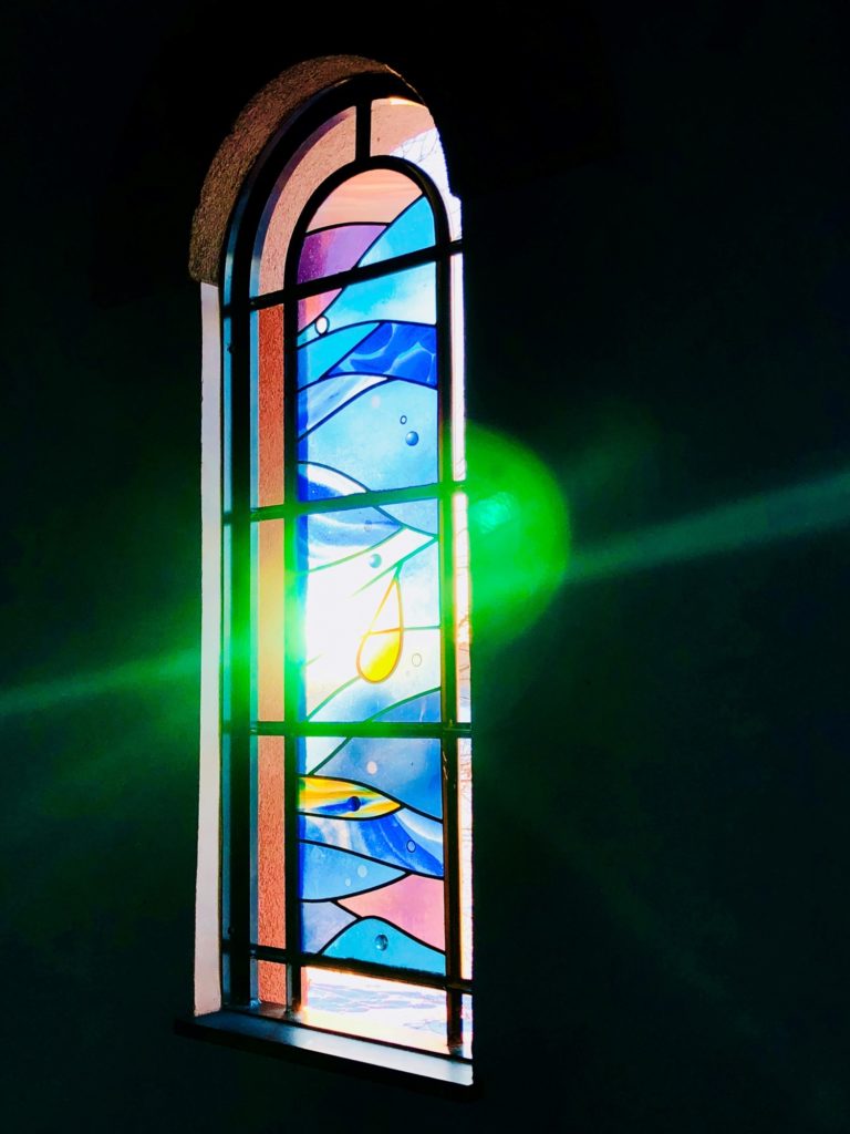 A photo of a stained glass window at Stella Maris chapel with